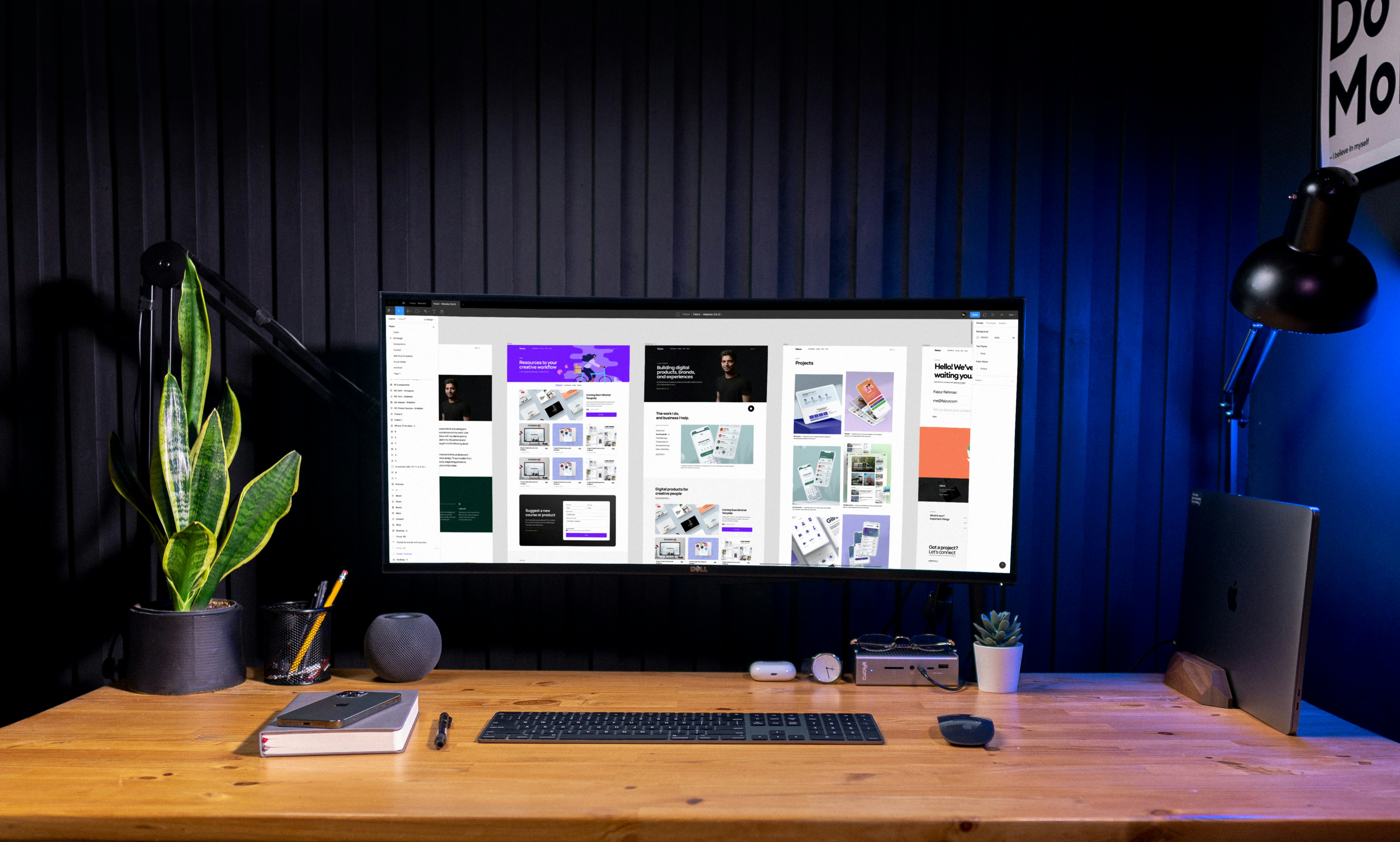 A computer monitor on a desk displaying high-fidelity user interface wireframes in Figma.