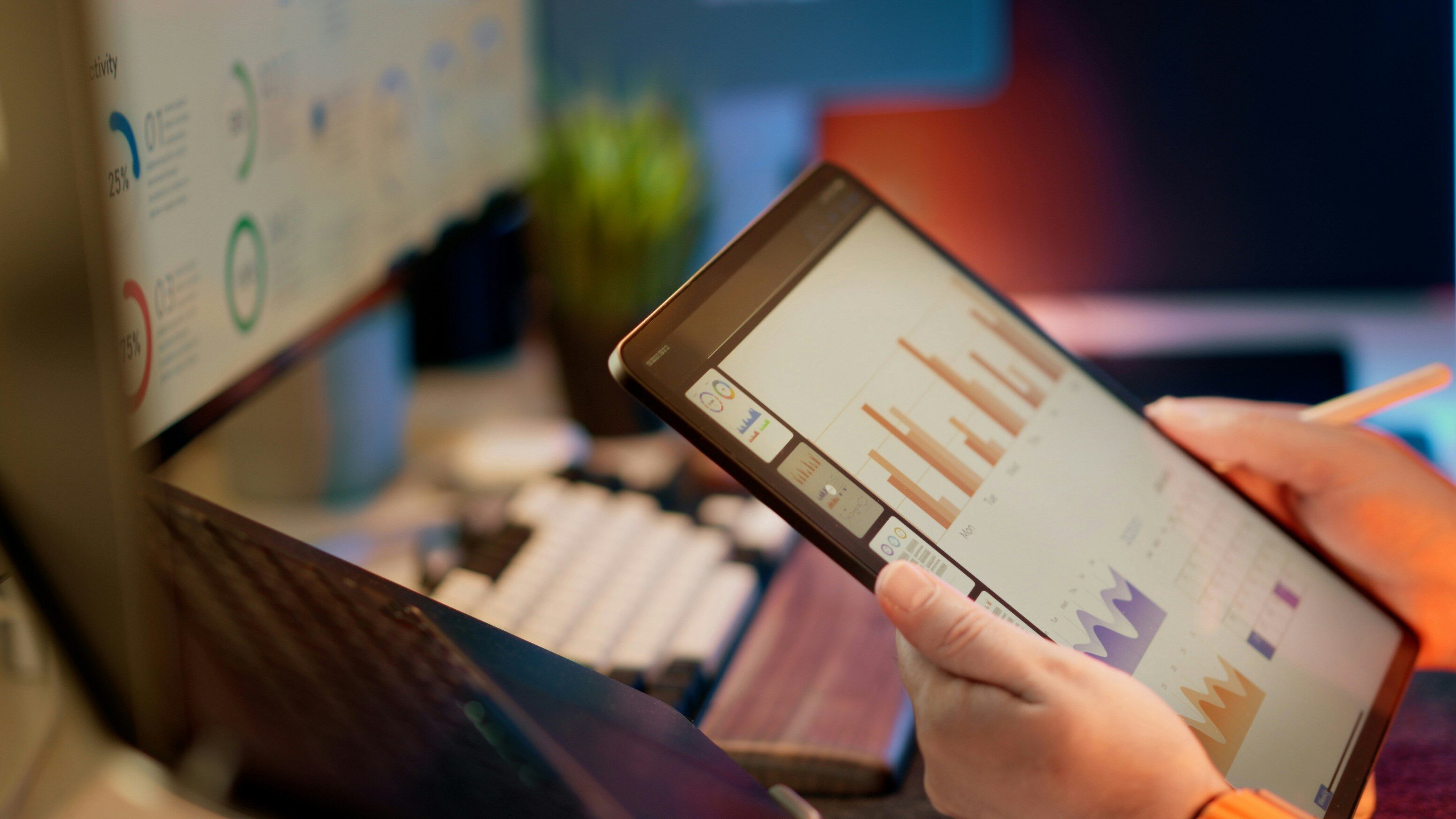 Computer monitors displaying business intelligence dashboards and data visualizations.