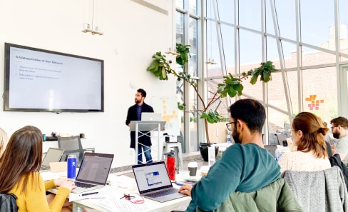 An Educator teaching students in a classroom at BrainStation New York.